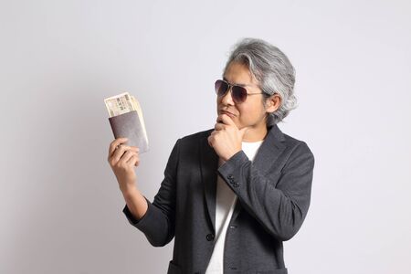 The adult Asian man on the white background.