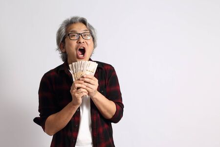 The adult Asian man on the white background.の写真素材