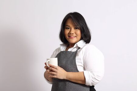 The Asian woman with apron.