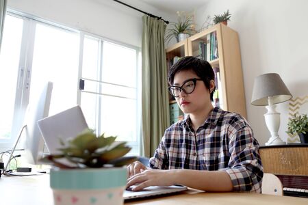 The Asian woman working in the home studio.の写真素材
