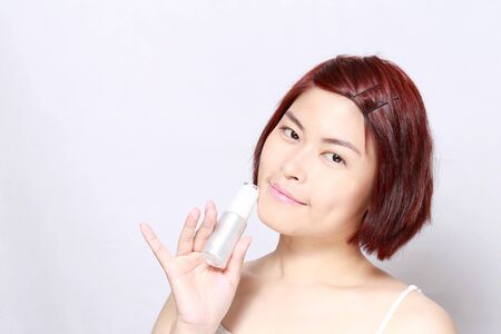The Asian woman's portrait on the white background.の写真素材