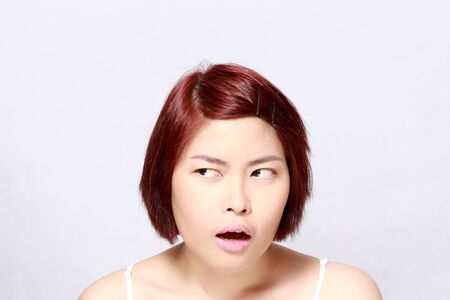The Asian woman's portrait on the white background.の写真素材