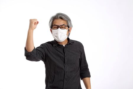 The senior Asian man on the white background.の写真素材