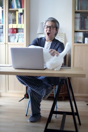 The Asian businessman does business in the house.の写真素材