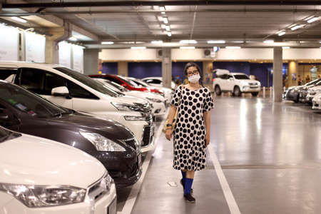 The Asian woman going shopping with face mask.のeditorial素材