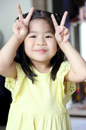 Tha Asian girl having fun in the playground.