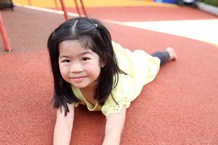 Tha Asian girl having fun in the playground.の写真素材
