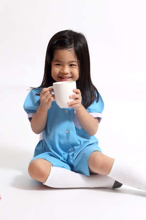 The young Asian girl on the white background.の写真素材