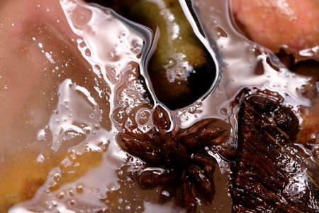 The abstract picture of dried flowers and leafs were frozen in the ice.