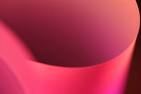 The abstract picture of curved paper in vivid colours.