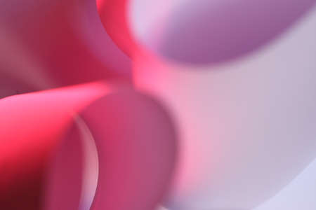 The abstract picture of curved paper in vivid colours.の写真素材