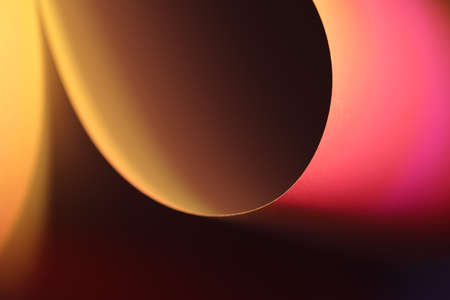 The abstract picture of curved paper in vivid colours.の写真素材