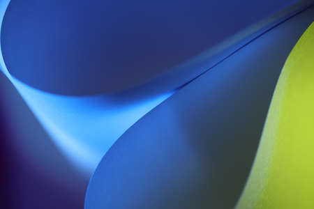 The abstract picture of curved paper in vivid colours.の写真素材