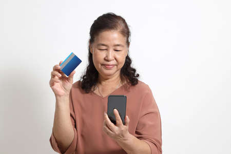 The Asian elder femaleon the white background.