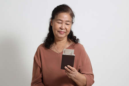 The Asian elder femaleon the white background.の写真素材