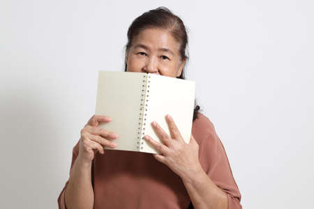 The Asian elder femaleon the white background.の写真素材