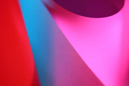 The abstract picture of curved paper in the vivid color light.の写真素材