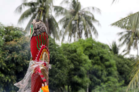The burning red big incense in the Chinese shrine area.の写真素材