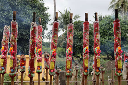The burning red big incense in the Chinese shrine area.の写真素材