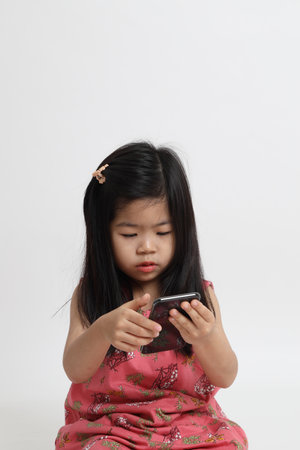 The Asian girl using smart phone.