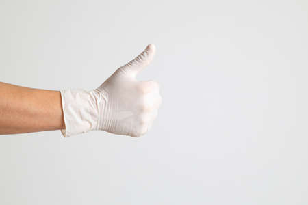 The human hand with glove on the white backgroundの写真素材