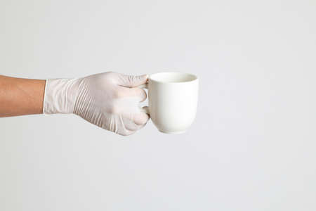 The human hand with glove on the white backgroundの写真素材