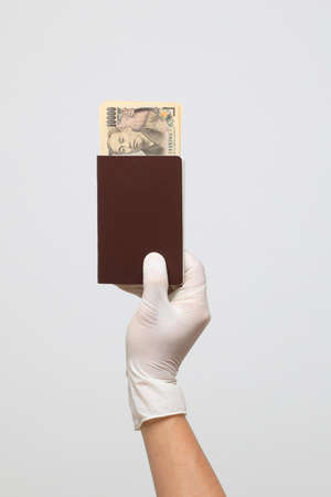 The human hand with glove on the white backgroundの写真素材