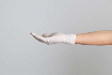 The human hand with glove on the white background