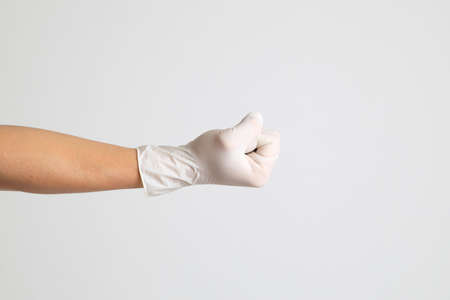 The human hand with glove on the white backgroundの写真素材
