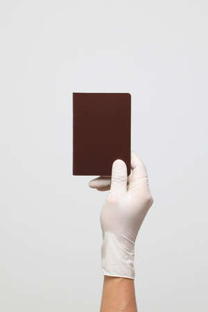 The human hand with glove on the white backgroundの写真素材