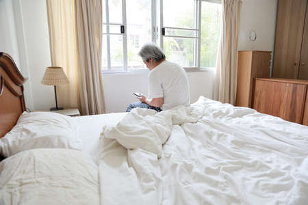 The senior Asian man in the bedroom.の写真素材