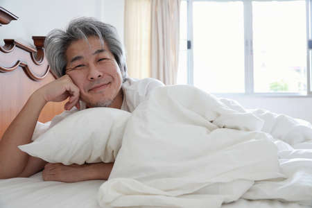 The senior Asian man in the bedroom.の写真素材