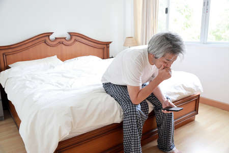 The senior Asian man in the bedroom.の写真素材