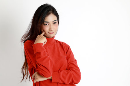The Asian womna standing on the white background.の写真素材