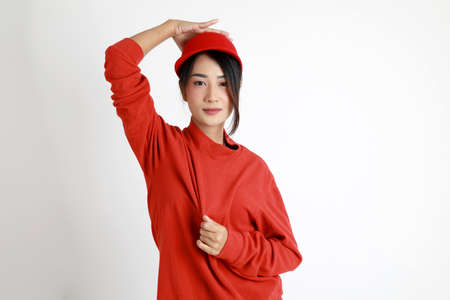 The Asian womna standing on the white background.の写真素材