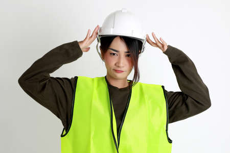 The Asian womna standing on the white background.の写真素材