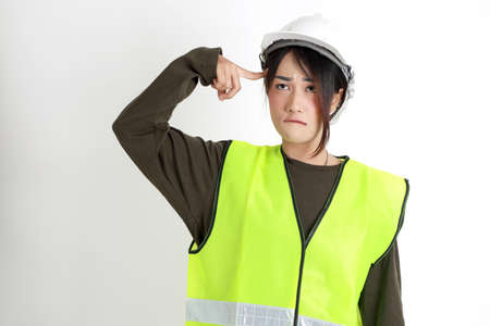 The Asian womna standing on the white background.の写真素材