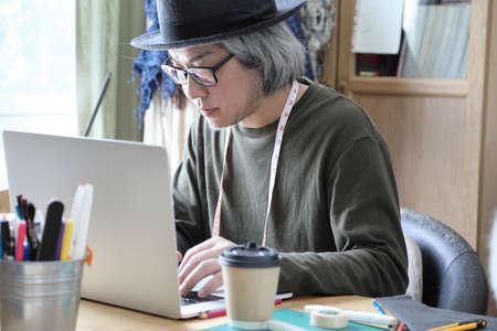 The senior Asian designer working in the studio.