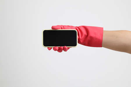 The pink gloves on the white background.の写真素材