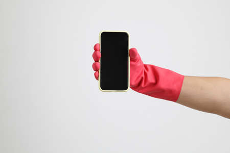 The pink gloves on the white background.の写真素材