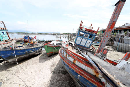 Chonburi, Thailand - October 03, 2021: The group of fishing boats parking at pier near Sam Muk, Chon Buri, Thailand.のeditorial素材