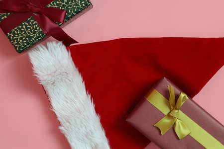 The gift boxes for Christmas season on the pink background.の写真素材