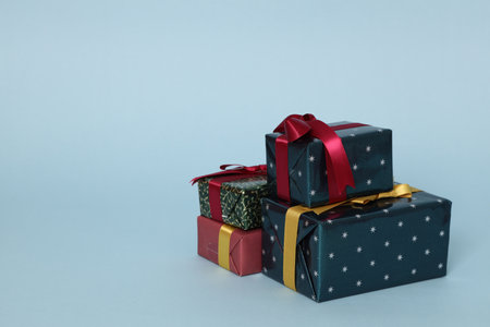 The isolated Christmas gifts on the blue background.の写真素材