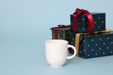 The isolated Christmas gifts on the blue background.の写真素材
