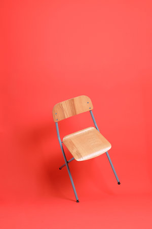 The isolated of chair floating on the orange background.の写真素材