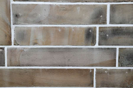 The old stone brick background showing the ruined from aged.