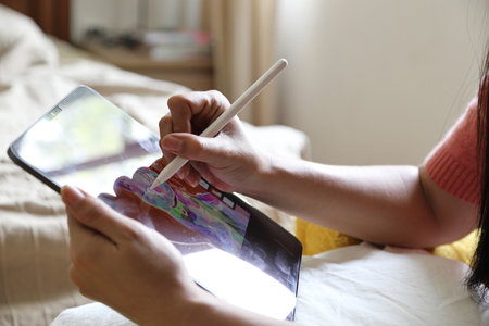 The Asian woman relaxing in the armchair in the bed room.の写真素材