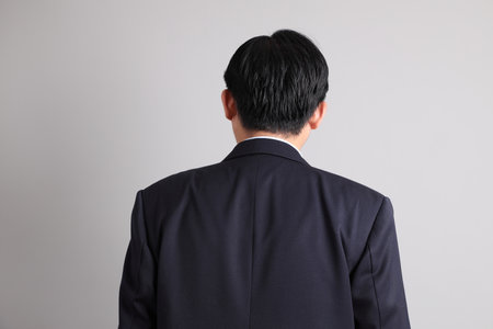 The Asian Businessman with formal dressed with gesture of standing on the gray background.の写真素材