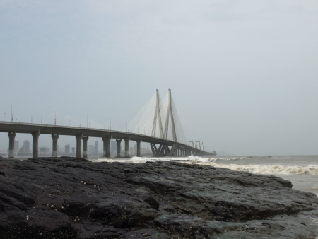 Iron bridge near the sea with gray sky in Mumbai, India, horizontal photographyの写真素材