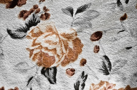 Fragment of colorful retro textile pattern with floral ornament useful as backgroundの写真素材